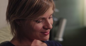 Movie still from “Tomboy” (2011), directed by Céline Sciamma – A woman's face with her eyes wide open; Close Up shot, Low angle
