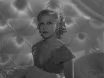 Movie still from “Top Hat” (1935), directed by Mark Sandrich – A black - and - white photo of a woman in a dress; Close Up shot, High angle