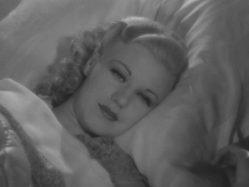 Movie still from “Top Hat” (1935), directed by Mark Sandrich – A woman laying in a bed with white sheets; Close Up shot, High angle