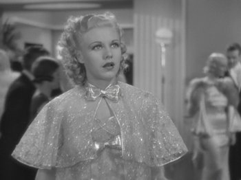 Movie still from “Top Hat” (1935), directed by Mark Sandrich – A young woman in a white dress and a cape; Close Up shot, Low angle