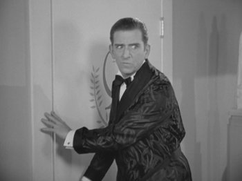 Movie still from “Top Hat” (1935), directed by Mark Sandrich – A black and white photo of a man in a tuxedo; Medium shot, Over the shoulder angle