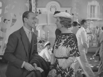 Movie still from “Top Hat” (1935), directed by Mark Sandrich – A man and a woman talking to each other in front of a crowd; Medium shot, Over the shoulder angle