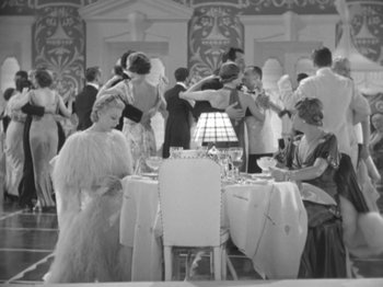 Movie still from “Top Hat” (1935), directed by Mark Sandrich – A group of people standing around a dining room table; Wide shot, High angle