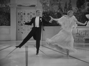 Movie still from “Top Hat” (1935), directed by Mark Sandrich – A man and a woman dancing in formal wear; Wide shot, High angle