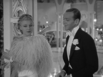 Movie still from “Top Hat” (1935), directed by Mark Sandrich – A man and a woman in formal attire; Medium shot, Low angle