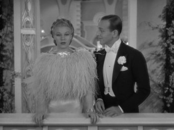 Movie still from “Top Hat” (1935), directed by Mark Sandrich – A man and a woman standing next to each other; Medium shot, Low angle