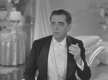 Movie still from “Top Hat” (1935), directed by Mark Sandrich – A man in a suit and a bow tie; Close Up shot, High angle