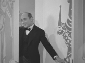 Movie still from “Top Hat” (1935), directed by Mark Sandrich – A black and white photo of a man in a tuxedo; Medium shot, Over the shoulder angle