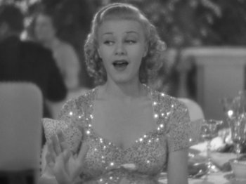 Movie still from “Top Hat” (1935), directed by Mark Sandrich – A black - and - white photo of a woman in a sequined dress; Close Up shot, Over the shoulder angle
