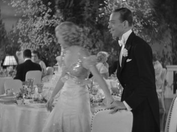 Movie still from “Top Hat” (1935), directed by Mark Sandrich – A man and a woman are dancing at an event; Medium shot, High angle