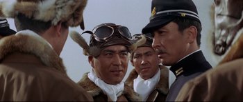 Movie still from “Tora! Tora! Tora!” (1970), directed by Kinji Fukasaku – A group of men wearing hats and fur coats; Close Up shot, Low angle