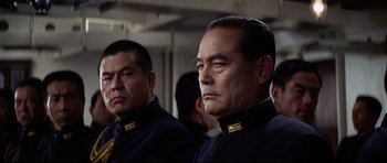 Movie still from “Tora! Tora! Tora!” (1970), directed by Kinji Fukasaku – Two men in military uniforms are looking at something; Close Up shot, Low angle