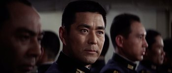 Movie still from “Tora! Tora! Tora!” (1970), directed by Kinji Fukasaku – A person wearing a military uniform; Close Up shot, Low angle