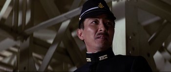 Movie still from “Tora! Tora! Tora!” (1970), directed by Kinji Fukasaku – A person wearing a uniform; Close Up shot, Low angle