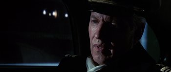 Movie still from “Tora! Tora! Tora!” (1970), directed by Kinji Fukasaku – A person wearing a hat in a car; Close Up shot, Low angle