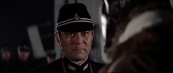 Movie still from “Tora! Tora! Tora!” (1970), directed by Kinji Fukasaku – A person wearing a uniform; Close Up shot, Over the shoulder angle