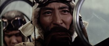 Movie still from “Tora! Tora! Tora!” (1970), directed by Kinji Fukasaku – A person wearing a hat and goggles; Close Up shot, Low angle