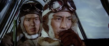 Movie still from “Tora! Tora! Tora!” (1970), directed by Kinji Fukasaku – Two men in military uniforms wearing goggles and hats; Close Up shot, Low angle