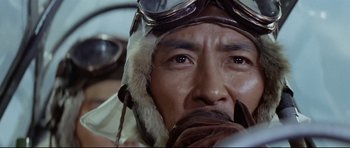 Movie still from “Tora! Tora! Tora!” (1970), directed by Kinji Fukasaku – A person wearing a pilot's hat; Close Up shot, Low angle