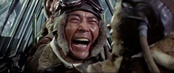 Movie still from “Tora! Tora! Tora!” (1970), directed by Kinji Fukasaku – An older man wearing a fur coat and a hat; Close Up shot, Low angle