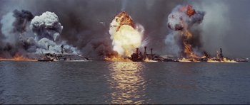 Movie still from “Tora! Tora! Tora!” (1970), directed by Kinji Fukasaku – An image of an explosion in the water of an ocean; Extreme Wide shot, Low angle