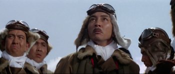 Movie still from “Tora! Tora! Tora!” (1970), directed by Kinji Fukasaku – A man wearing a jacket and a fur hat; Close Up shot, Low angle
