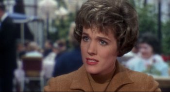 Movie still from “Torn Curtain” (1966), directed by Alfred Hitchcock – A person wearing a brown jacket; Close Up shot, Over the shoulder angle