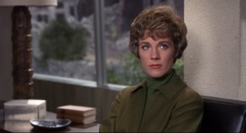 Movie still from “Torn Curtain” (1966), directed by Alfred Hitchcock – A person sitting in front of a window; Close Up shot, Over the shoulder angle