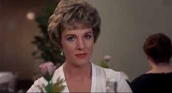 Movie still from “Torn Curtain” (1966), directed by Alfred Hitchcock – A person wearing a white shirt; Close Up shot, Over the shoulder angle