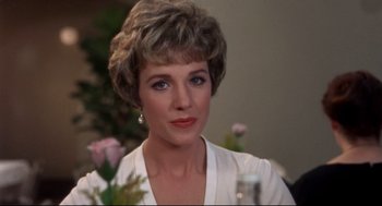 Movie still from “Torn Curtain” (1966), directed by Alfred Hitchcock – A person wearing a white shirt; Close Up shot, Over the shoulder angle