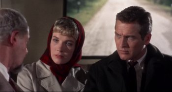 Movie still from “Torn Curtain” (1966), directed by Alfred Hitchcock – A man and a woman standing next to each other; Close Up shot, Low angle