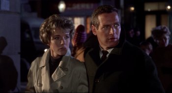 Movie still from “Torn Curtain” (1966), directed by Alfred Hitchcock – A man and a woman standing next to each other; Close Up shot, Over the shoulder angle