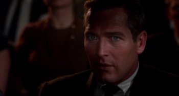 Movie still from “Torn Curtain” (1966), directed by Alfred Hitchcock – A person wearing a suit and tie; Close Up shot, Over the shoulder angle