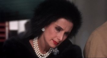 Movie still from “Torn Curtain” (1966), directed by Alfred Hitchcock – A person wearing pearls and a necklace; Close Up shot, High angle