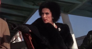 Movie still from “Torn Curtain” (1966), directed by Alfred Hitchcock – A woman in a black fur coat and a pearl necklace; Close Up shot, Low angle