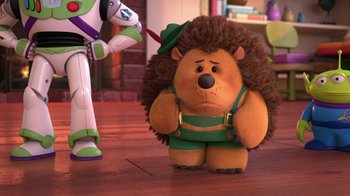 Movie still from “Toy Story That Time Forgot” (2014), directed by Steve Purcell – A toy story character is standing next to a stuffed animal; Medium shot, Over the shoulder angle