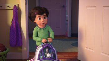 Movie still from “Toy Story That Time Forgot” (2014), directed by Steve Purcell – A little girl riding in a toy story backpack; Medium shot, High angle