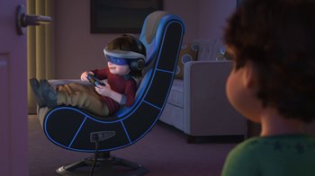 Movie still from “Toy Story That Time Forgot” (2014), directed by Steve Purcell – A child sitting in a rocking chair with a remote control; Wide shot, High angle