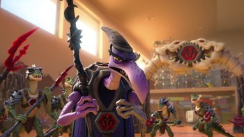 Movie still from “Toy Story That Time Forgot” (2014), directed by Steve Purcell – A character in a cartoon is holding a staff; Medium shot, Low angle