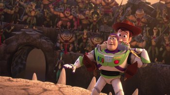 Movie still from “Toy Story That Time Forgot” (2014), directed by Steve Purcell – A scene from toy story that is being watched by a bunch of people; Wide shot, Over the shoulder angle