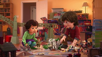 Movie still from “Toy Story That Time Forgot” (2014), directed by Steve Purcell – Two children playing with toys in a room; Wide shot, High angle