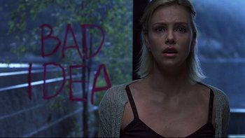 Movie still from “Trapped” (2002), directed by Luis Mandoki – A woman standing in front of a window with graffiti on it; Close Up shot, Low angle