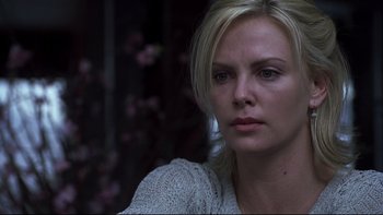 Movie still from “Trapped” (2002), directed by Luis Mandoki – Charlize theron in a scene from the movie young adult; Close Up shot, Over the shoulder angle