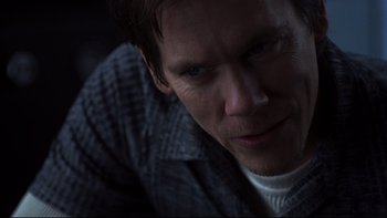 Movie still from “Trapped” (2002), directed by Luis Mandoki – A person looking at the camera; Close Up shot, Over the shoulder angle
