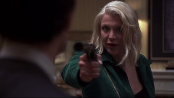 Movie still from “Trapped” (2002), directed by Luis Mandoki – A woman holding a gun pointed at a man; Close Up shot, Over the shoulder angle