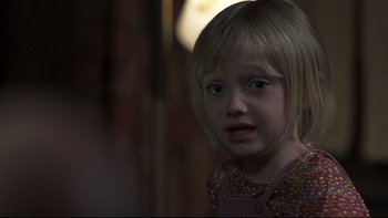 Movie still from “Trapped” (2002), directed by Luis Mandoki – A little girl is crying in the dark; Close Up shot, Over the shoulder angle