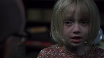 Movie still from “Trapped” (2002), directed by Luis Mandoki – A little girl with blonde hair and blue eyes; Close Up shot, High angle