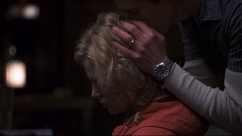 Movie still from “Trapped” (2002), directed by Luis Mandoki – A woman with her hand on the head of another person; Close Up shot, Over the shoulder angle