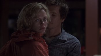 Movie still from “Trapped” (2002), directed by Luis Mandoki – A man and a woman standing next to each other; Close Up shot, Over the shoulder angle