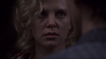 Movie still from “Trapped” (2002), directed by Luis Mandoki – A woman's face in the dark; Close Up shot, Over the shoulder angle